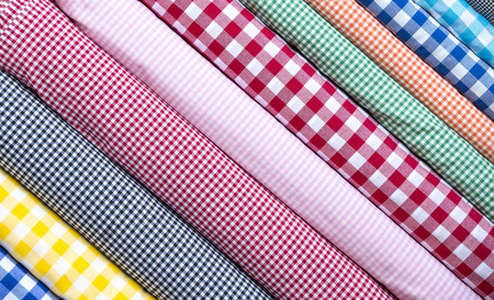 Background of the scrolls rolls colored colorful fabric