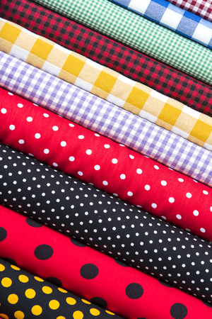 Background of the scrolls rolls colored colorful fabric