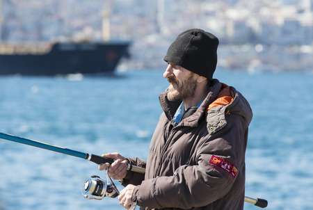 ISTANBUL, TURKEY - 3 APRIL, 2017: Fishermen are fishing on the banks of the Bosphorus in Istanbul Turkeyのeditorial素材