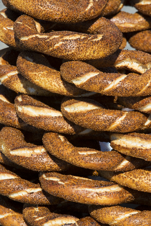 Background with Turkish bagels simit, close-up