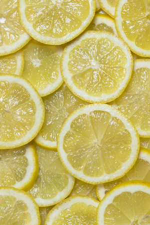 Background citrus ripe juicy slices of orange lemon shot close-upの写真素材