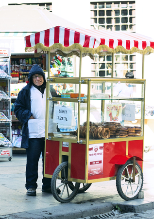 ISTANBUL, TURKEY - 1 APRIL, 2017: Street sales of traditional Turkish bagels Simit, are on the...