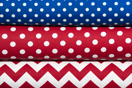 Background of the scrolls rolls colored colorful fabric
