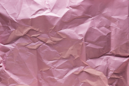 Background of colored crumpled paper shot close-upの写真素材
