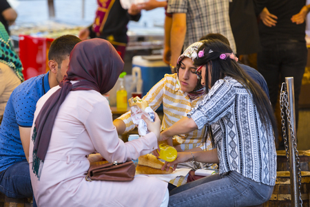 ISTANBUL, TURKEY - 2 JUNE, 2016: Food courts with traditional sandwiches with fish in Istanbul near the Galata Bridgeのeditorial素材