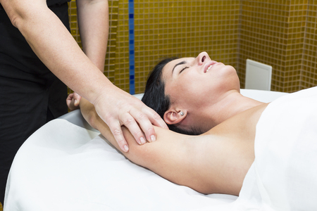 Woman in a beauty salon doing massageの写真素材
