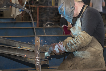 KHARKOV, UKRAINE - 8 JUNE 2017: Metalworking shop workers work machines and apparatuses to create steel structures.Kharkov. Ukraine-2017のeditorial素材