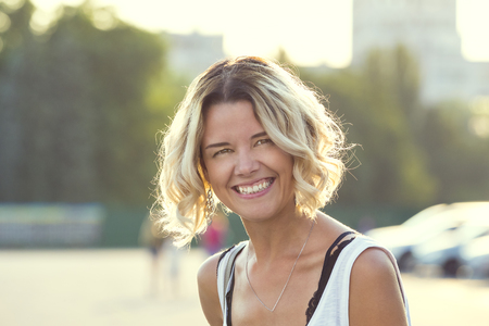 Portrait of a girl in a summer park outdoorsの写真素材