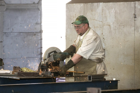KHARKOV, UKRAINE - 8 JUNE 2017: Metalworking shop workers work machines and apparatuses to create steel structures.Kharkov. Ukraine-2017のeditorial素材