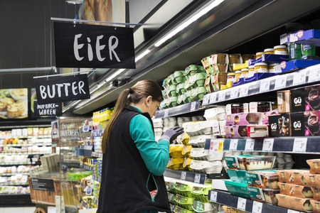 HAINBURG AN DER DONAU, AUSTRIA - 24 AUGUST 2017,: Supermarket with shelves of food and beverages Merkur in Austriaのeditorial素材