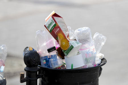 BUDAPEST, HUNGARY - 19 AUGUST 2017: Street trash cans are filled with garbage cans with plastic bottles of scans up to the top.のeditorial素材