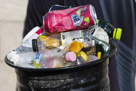 BUDAPEST, HUNGARY - 19 AUGUST 2017: Street trash cans are filled with garbage cans with plastic bottles of scans up to the top.のeditorial素材