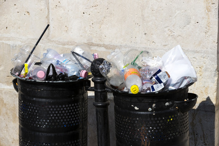 BUDAPEST, HUNGARY - 19 AUGUST 2017: Street trash cans are filled with garbage cans with plastic bottles of scans up to the top.のeditorial素材