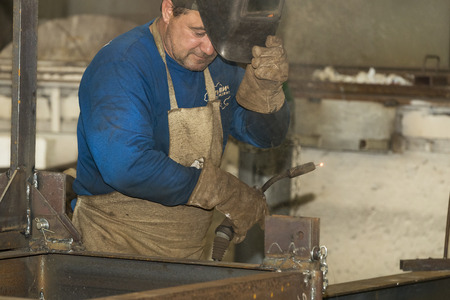 KHARKOV, UKRAINE - 8 JUNE 2017: Metalworking shop workers work machines and apparatuses to create steel structures.Kharkov. Ukraine-2017のeditorial素材