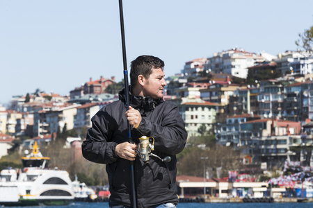 ISTANBUL, TURKEY - 3 APRIL, 2017: Fishermen are fishing on the banks of the Bosphorus in Istanbul Turkeyのeditorial素材