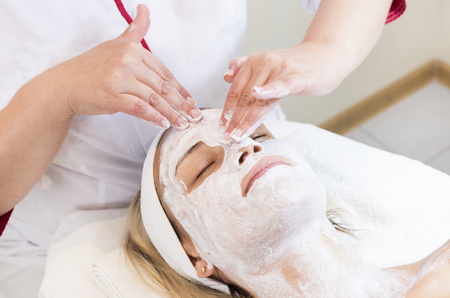 Process cosmetic mask of massage and facials in beauty salonの写真素材