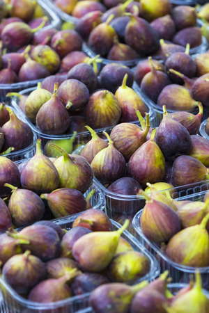 Background of ripe juicy figs on the market stalls shot closeupの写真素材