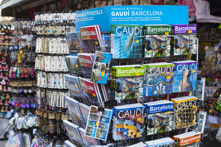 BARCELONA, SPAIN - 11 JANUARY 2018: Racks and shelves with magnets and souvenirs for tourists and guests of the cityのeditorial素材