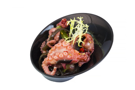 Mini canapes with seafood and vegetables and herbs and in plastic utensils isolated on white background.の写真素材