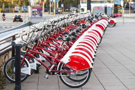 BARCELONA, SPAIN - 11 JANUARY 2018: Bicycles on the street for rent and travel around the cityのeditorial素材