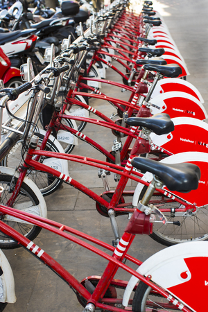 BARCELONA, SPAIN - 11 JANUARY 2018: Bicycles on the street for rent and travel around the cityのeditorial素材