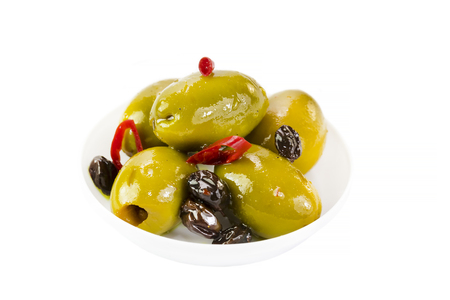 Olives in a small plastic plate on a white background.の写真素材