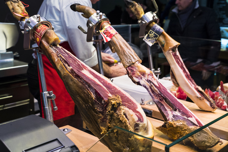 BARCELONA, SPAIN - 11 JANUARY 2018: The old grocery market of Barcelona Boqueria selling food jamon vegetables for tourists and visitors to the city.のeditorial素材