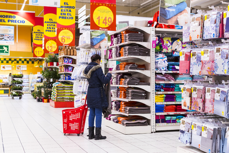 MADRID, SPAIN - 26 MARCH, 2018: Large food supermarket Auchan with customers and products and staff.のeditorial素材