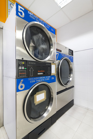 MADRID, SPAIN - 27 MARCH, 2018: Public laundry with mashinam for a street in the city of Madrid.のeditorial素材