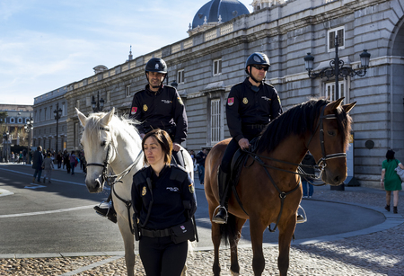 MADRID, SPAIN - 29 MARCH, 2018: Mounted police look after the order in the streets of the city