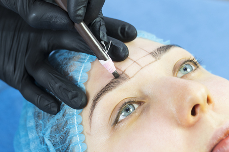 Microblading eyebrows workflow in a beauty salonの写真素材