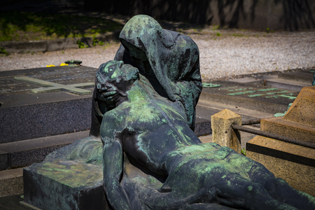 5 JUNE 2018, MILAN, ITALY: Statues of mourning at the graves of the monumental cemetery in Milan.のeditorial素材