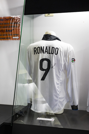 6 JUNE 2018, MILAN, ITALY: The museum is famous for players of football clubs. Inter Milan and Milan T-shirts at the San Siro stadium.のeditorial素材