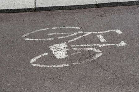 Marking on the bike lane and traffic signsの写真素材