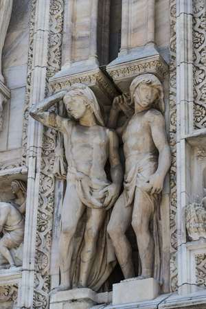 2 JUNE 2018, MILAN, ITALY: Sculptures of saints and martyrs decorating the Cathedral of Milan (Duomo di Milano) are shot closeup.のeditorial素材