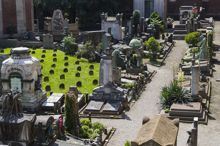 5 JUNE 2018, MILAN, ITALY: Statues of mourning at the graves of the monumental cemetery in Milan.のeditorial素材