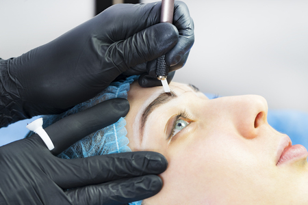 Microblading eyebrows workflow in a beauty salonの写真素材