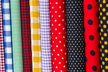 Colorful fabric scarves in stack as backgroundの写真素材