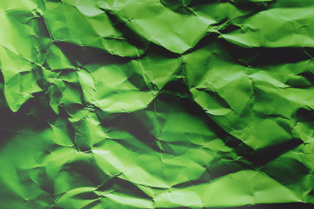 Background of colored crumpled paper shot close-upの写真素材