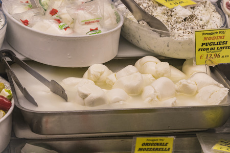 7 JUNE 2018, MILAN, ITALY: Showcases and shelves of the Wagner Market in Milan with many kinds of cheeses.のeditorial素材