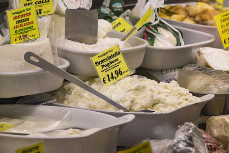 7 JUNE 2018, MILAN, ITALY: Showcases and shelves of the Wagner Market in Milan with many kinds of cheeses.のeditorial素材
