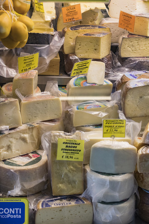 7 JUNE 2018, MILAN, ITALY: Showcases and shelves of the Wagner Market in Milan with many kinds of cheeses.のeditorial素材