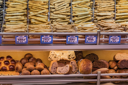 7 JUNE 2018, MILAN, ITALY: Showcases and shelves of the Wagner Market in Milan with many with assortment of cheeses, meat, vegetables and seafoodのeditorial素材