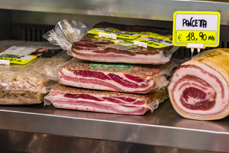 7 JUNE 2018, MILAN, ITALY: Showcases and shelves of the Wagner Market in Milan with many with assortment of cheeses, meat, vegetables and seafoodのeditorial素材
