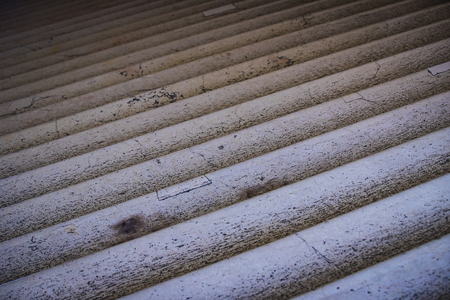 Background of old cracked marble stairs close-up