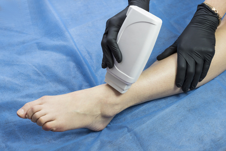 Process depilation female legs and hands in a beauty salonの写真素材