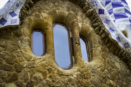 BARCELONA, SPAIN - 13 JANUARY 2018: Elements of mosaic fragments Gaudi's mosaic work in Park Guell in the winter in the city of Barcelona.のeditorial素材
