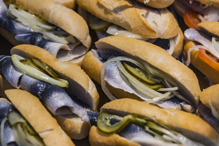 Sandwich with fish at the fair close-up shot.の写真素材