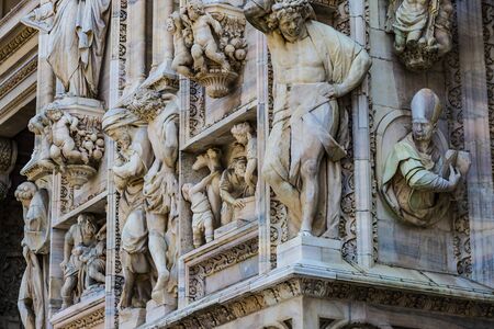 2 JUNE 2018, MILAN, ITALY: Sculptures of saints and martyrs decorating the Cathedral of Milan (Duomo di Milano) are shot closeup.のeditorial素材
