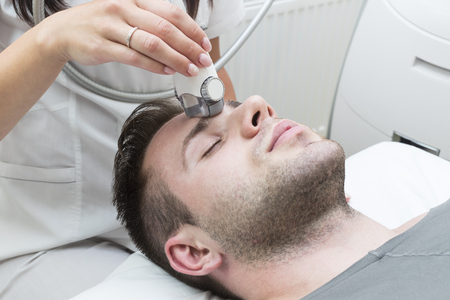 Male is in the process at the clinic lipomassageの写真素材